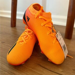 adidas Kids Soccer Cleats in Bright Orange with Black Accents